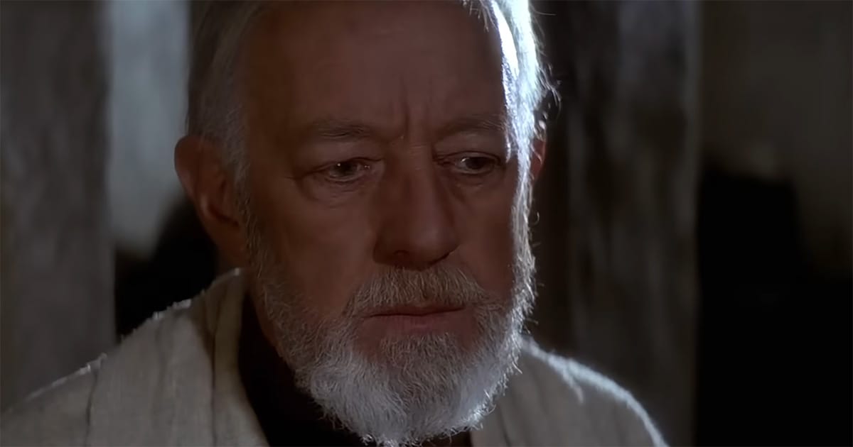 Close-up of Obi-Wan Kenobi in Star Wars showing reflective expression symbolizing the Grey Jedi idea between light and dark.