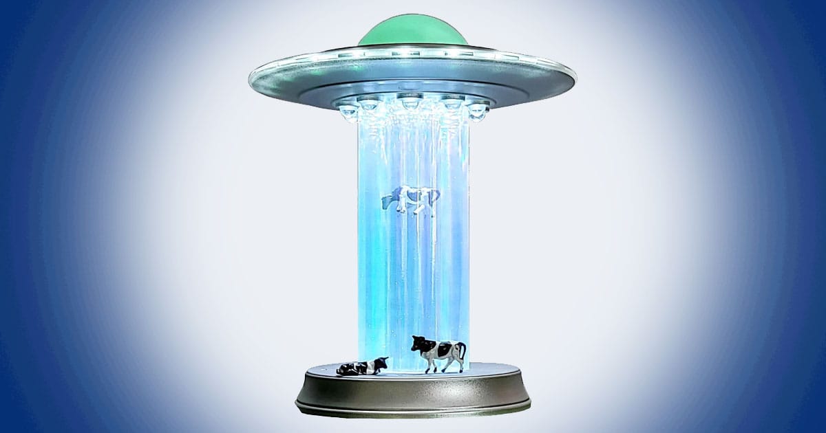 UFO cow abduction lamp with glowing tractor beam, floating cattle figures, and retro extraterrestrial science fiction design.