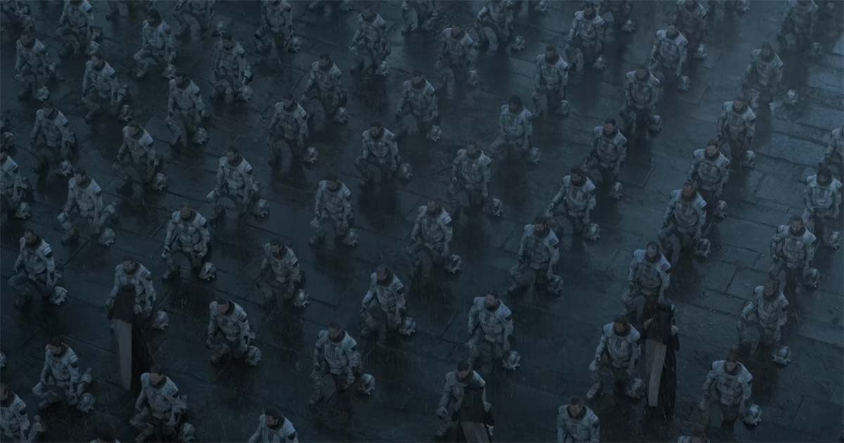 Overhead view of rows of kneeling Sardaukar arranged in precise formation during a ceremonial gathering.