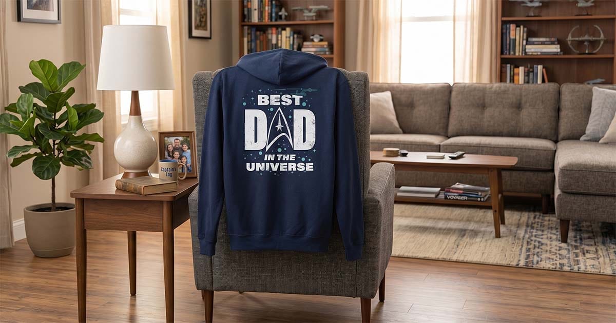 “Best Dad in the Universe” “Star Trek” themed sci-fi hoodie displayed in a suburban living room.