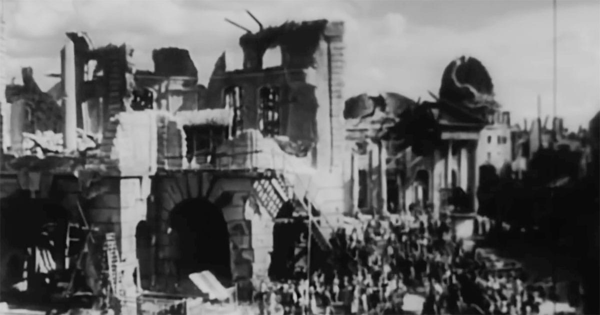 Ruined city filled with crowds in "Things to Come" (1936) showing the collapse of civilization after prolonged war.