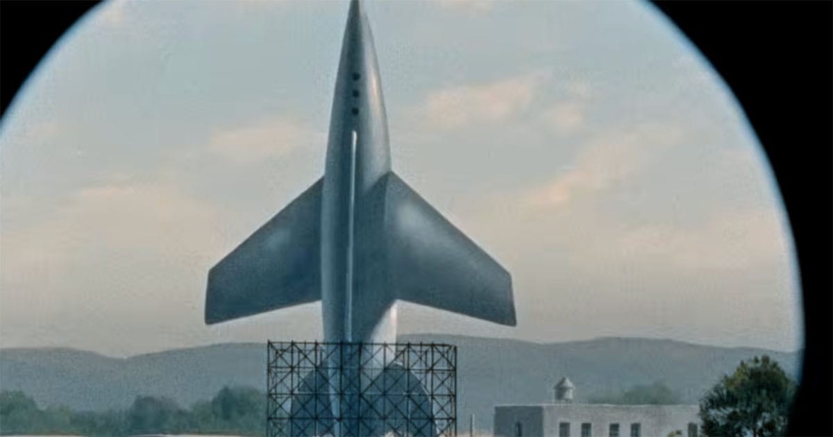Scene from "Invaders from Mars" showing a rocket on a launch platform, representing a coordinated military and scientific response to an alien threat.