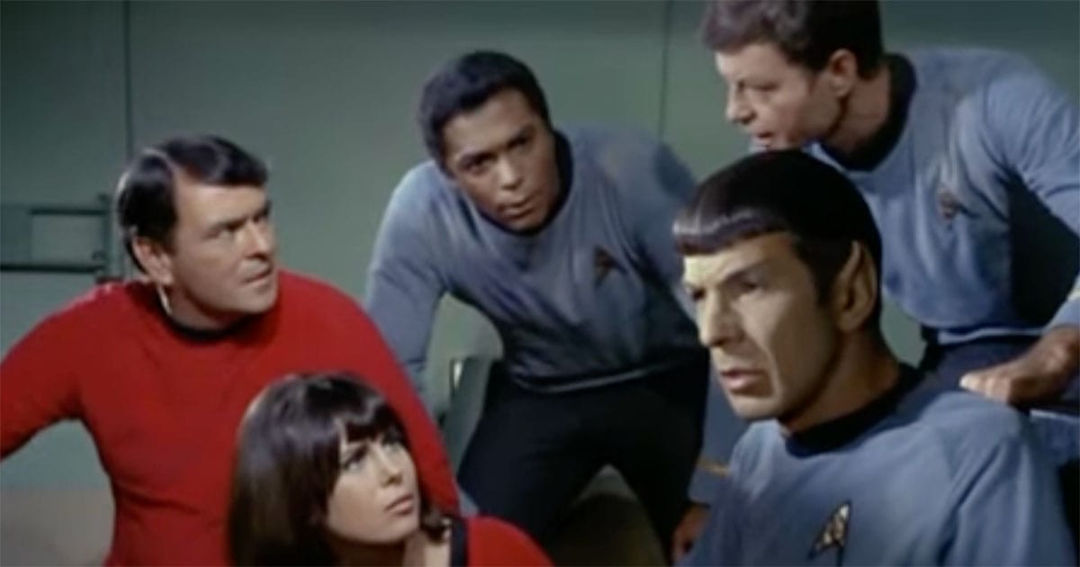 Spock and stranded Enterprise crew members debating survival decisions in the classic "Star Trek" episode "The Galileo Seven"