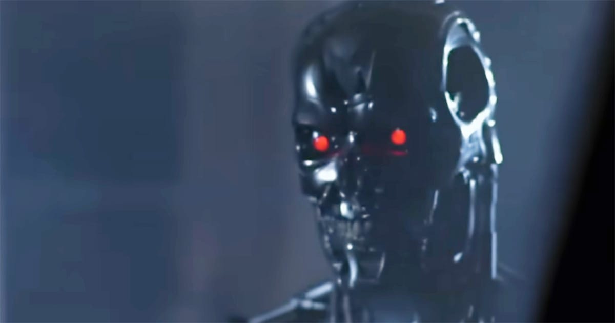 Close-up of the Terminator endoskeleton with glowing red eyes in blue haze from "The Terminator."