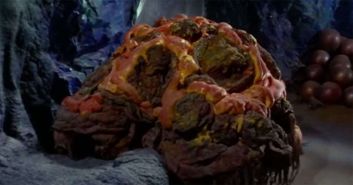 A still from “Star Trek The Original Series” showing the Horta resting in its underground chamber with its eggs visible in the background.