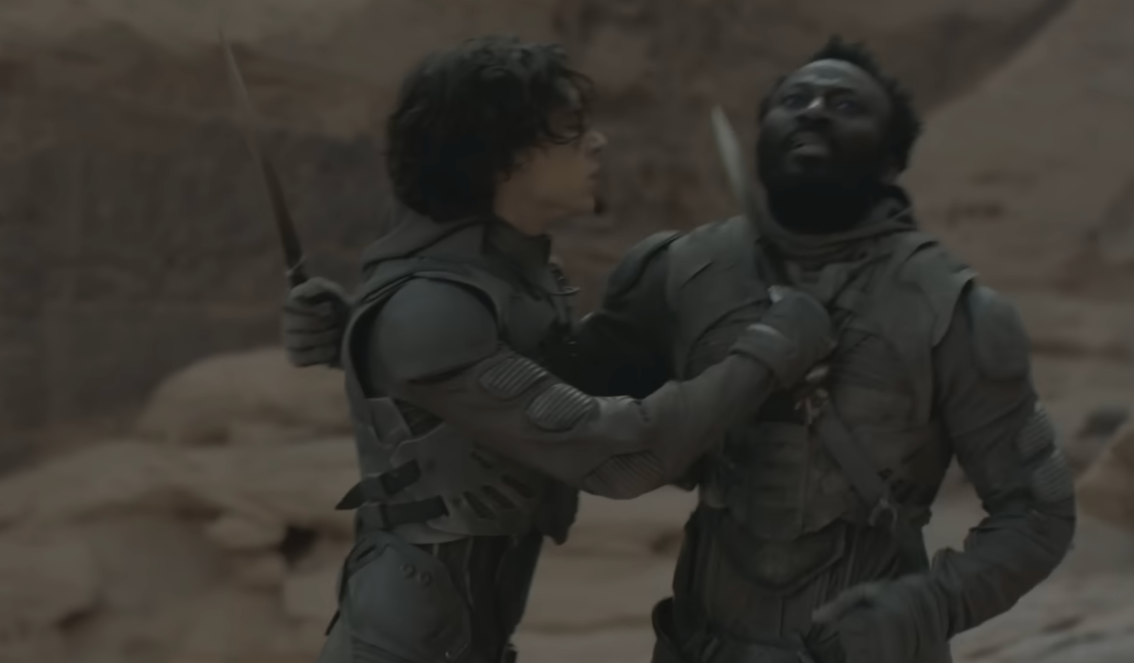 Paul Atreides holding a crysknife after defeating Jamis in ritual combat in "Dune Part Two."