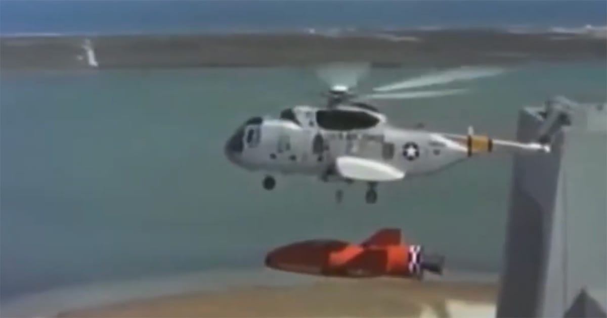 Recovery helicopter approaches the returning spacecraft after the rescue operation in "Marooned".