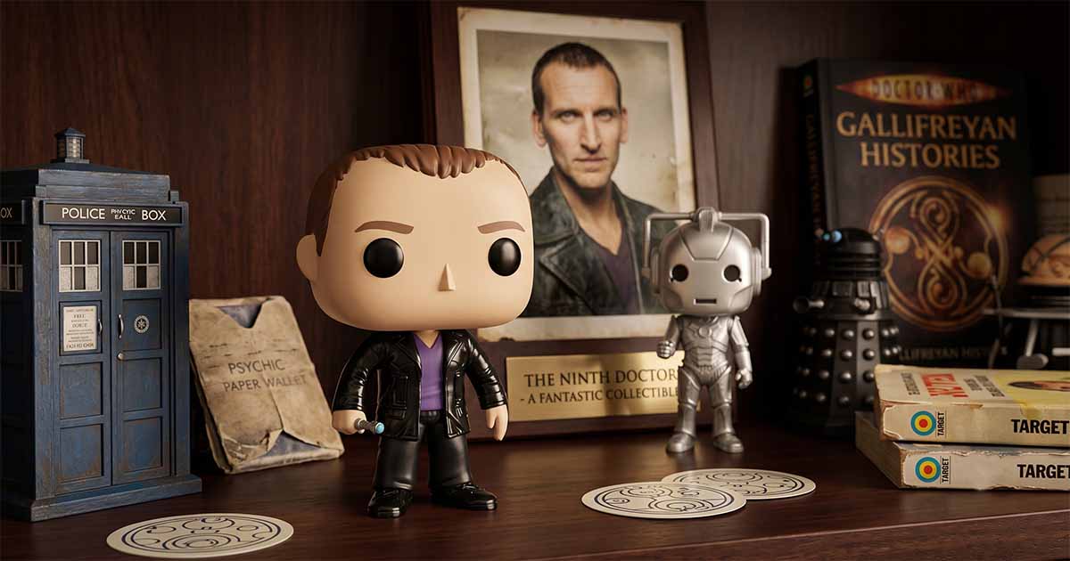 Ninth Doctor Funko Pop figure displayed beside a TARDIS model, Cyberman figure, Dalek, and Doctor Who memorabilia on a wooden shelf.