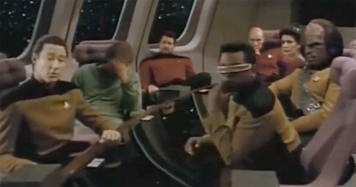Data from "Star Trek: The Next Generation" seated with the Enterprise crew while exploring themes of humanity, friendship, and artificial intelligence.