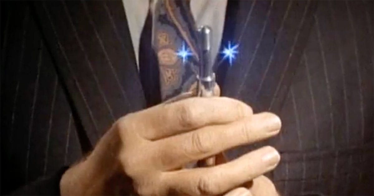 Gary Seven holds his glowing servo pen in the "Star Trek" episode "Assignment: Earth."
