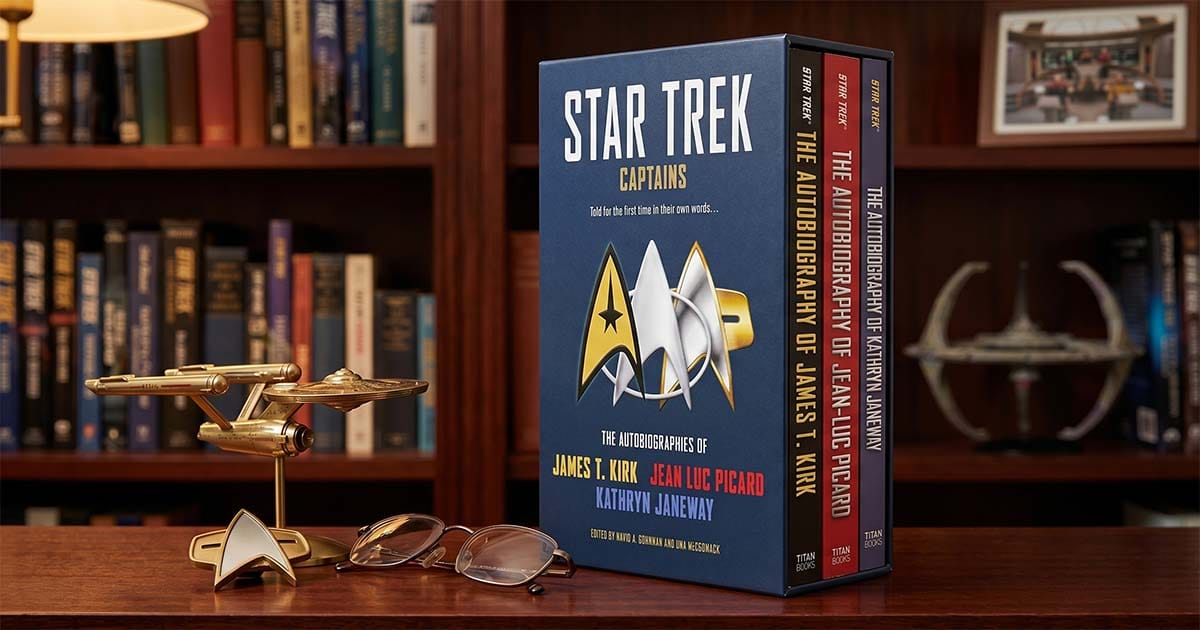 Star Trek Captains autobiographies boxed set featuring books about James T. Kirk, Jean-Luc Picard, and Kathryn Janeway displayed in a science fiction library.