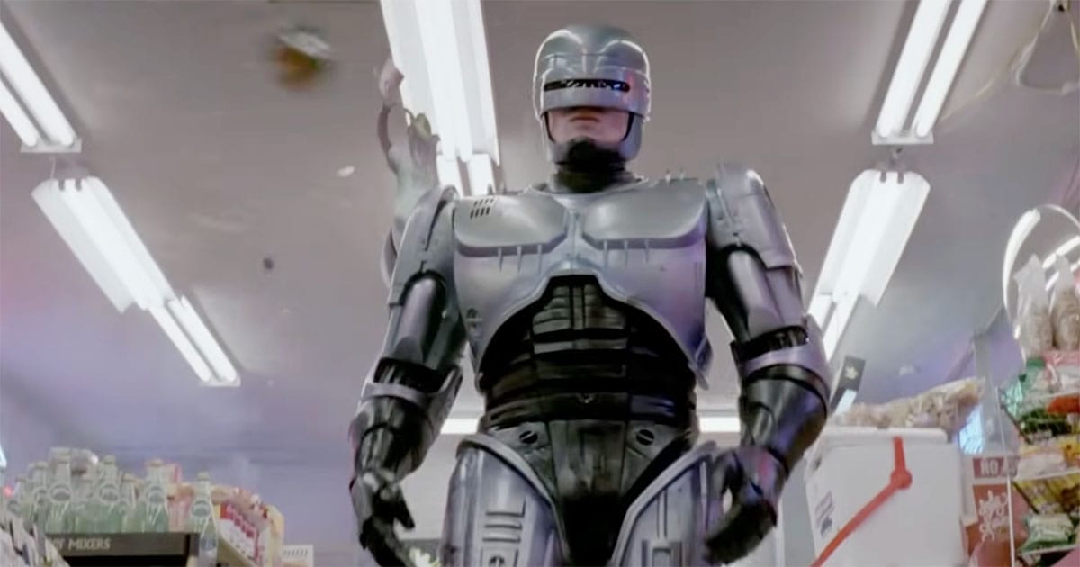 RoboCop walks through a convenience store wearing his silver cybernetic armor in a scene from the 1987 science fiction film "RoboCop".