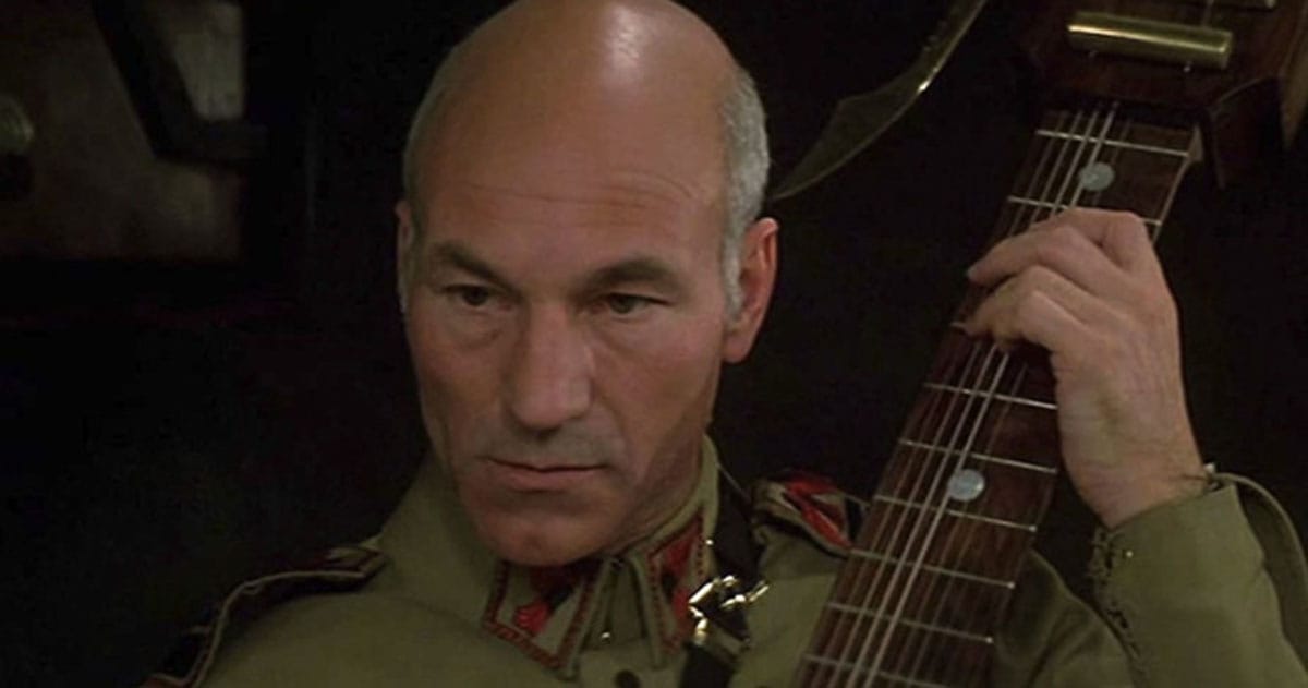 Patrick Stewart as Gurney Halleck holds his baliset in "Dune" (1984).