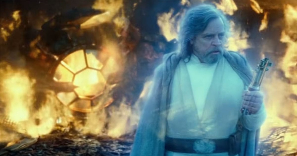 Force ghost of Luke Skywalker holding Rey's lightsaber in "The Rise of Skywalker."