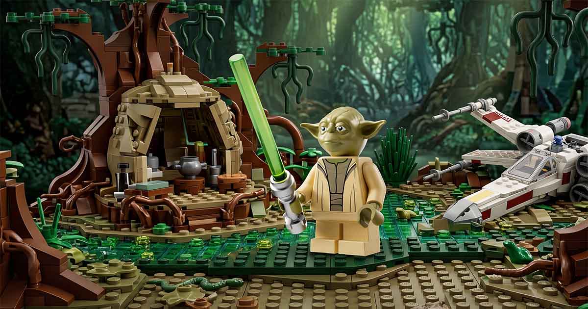 LEGO "Star Wars" Yoda minifigure with a green lightsaber standing outside his hut on Dagobah with an X Wing starfighter nearby.