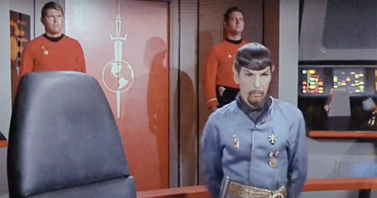 Mirror Universe Spock aboard the Enterprise with armed guards and the Terran Empire insignia in "Star Trek."