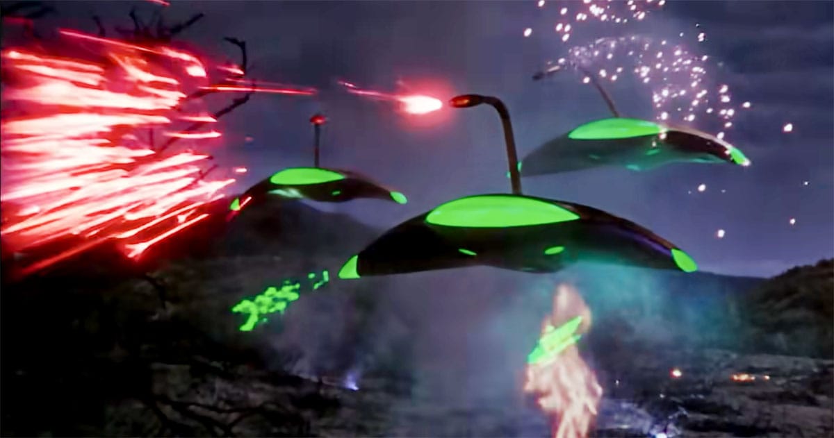 Martian war machines advance through explosions and weapons fire in "The War of the Worlds" (1953).