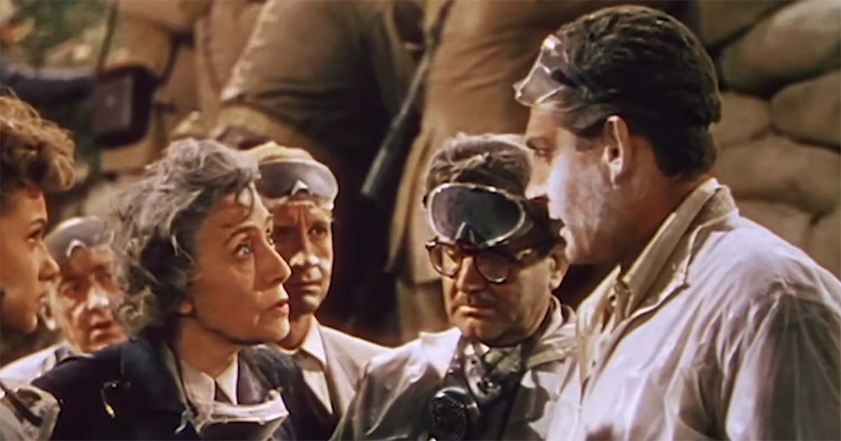 Scientists wearing protective goggles examine the Martian threat in "The War of the Worlds" (1953).