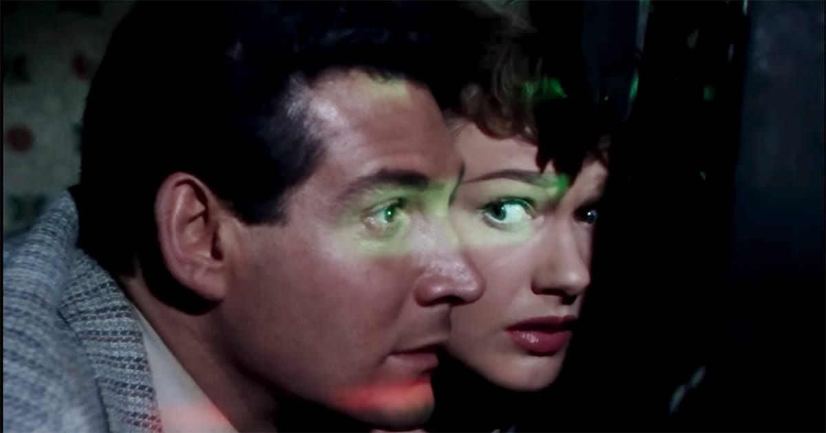Clayton Forrester and Sylvia Van Buren watch the Martian threat together in "The War of the Worlds" (1953).