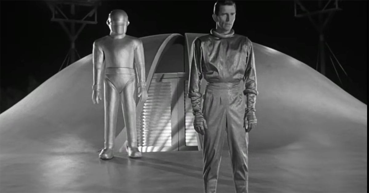 Klaatu stands in front of Gort and the spacecraft in "The Day the Earth Stood Still" (1951).