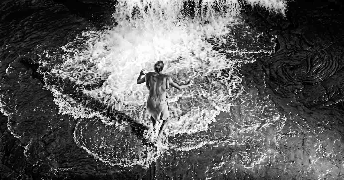 The tiny Scott Carey fights through floodwater pouring across the basement floor in “The Incredible Shrinking Man.”