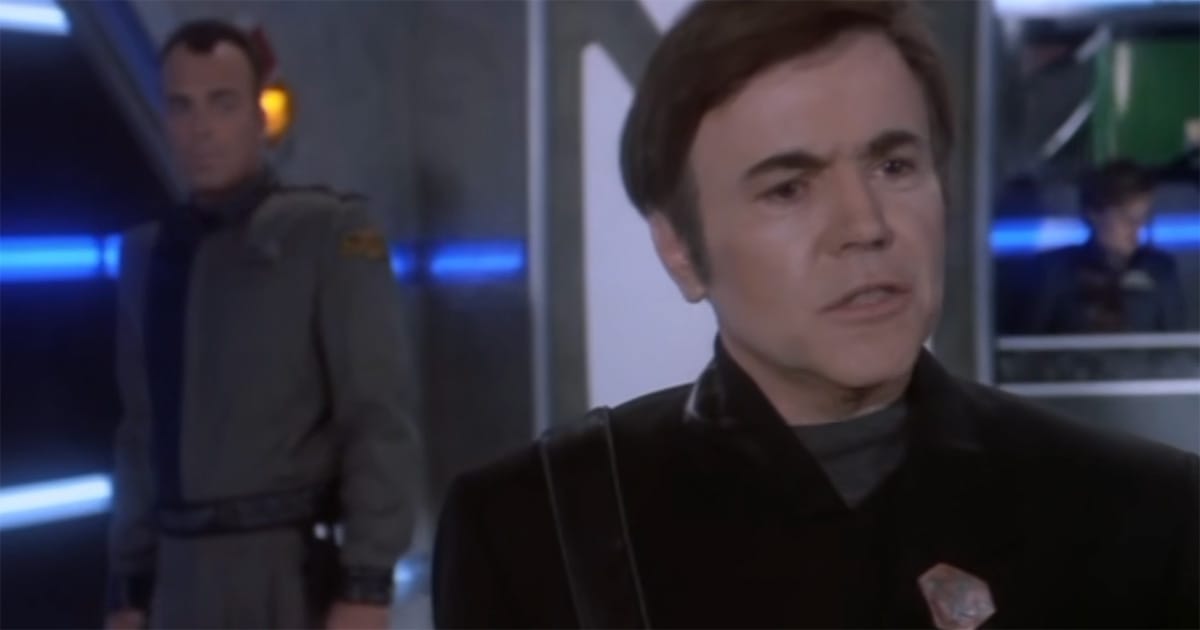 Walter Koenig as Alfred Bester in a black Psi Corps uniform aboard “Babylon 5.”
