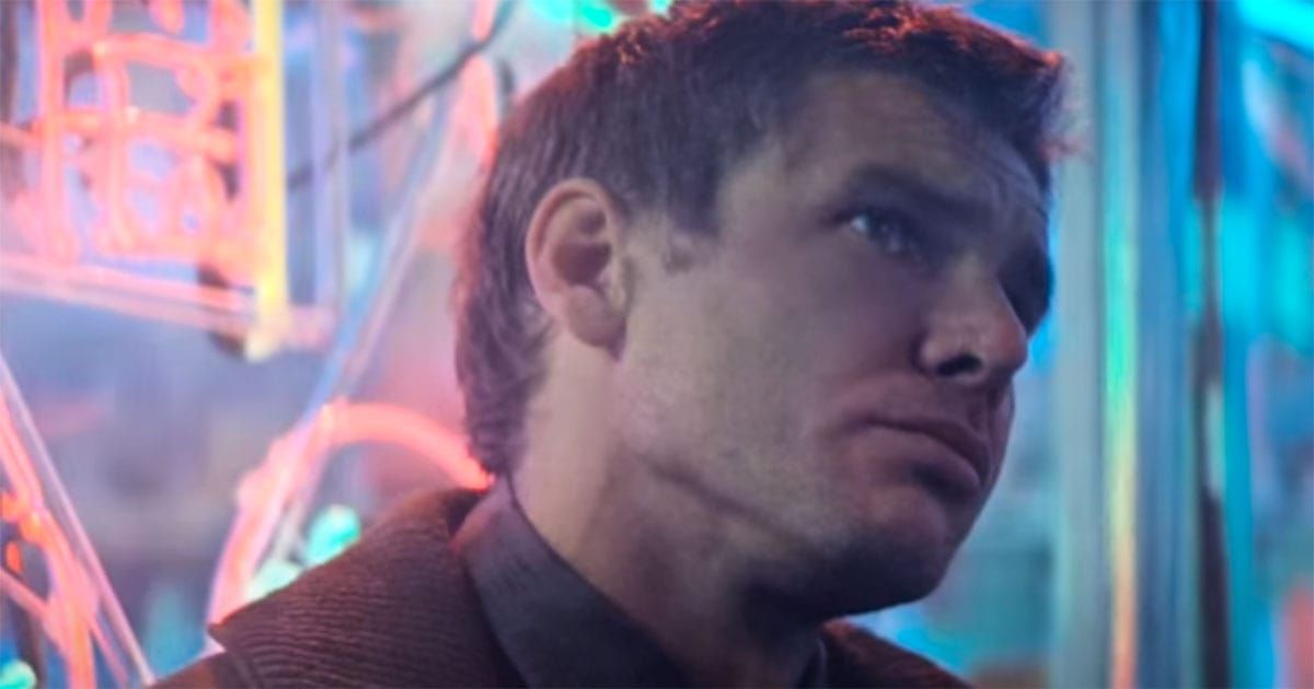Rick Deckard lost in thought beneath neon lights, caught between orders and awakening.