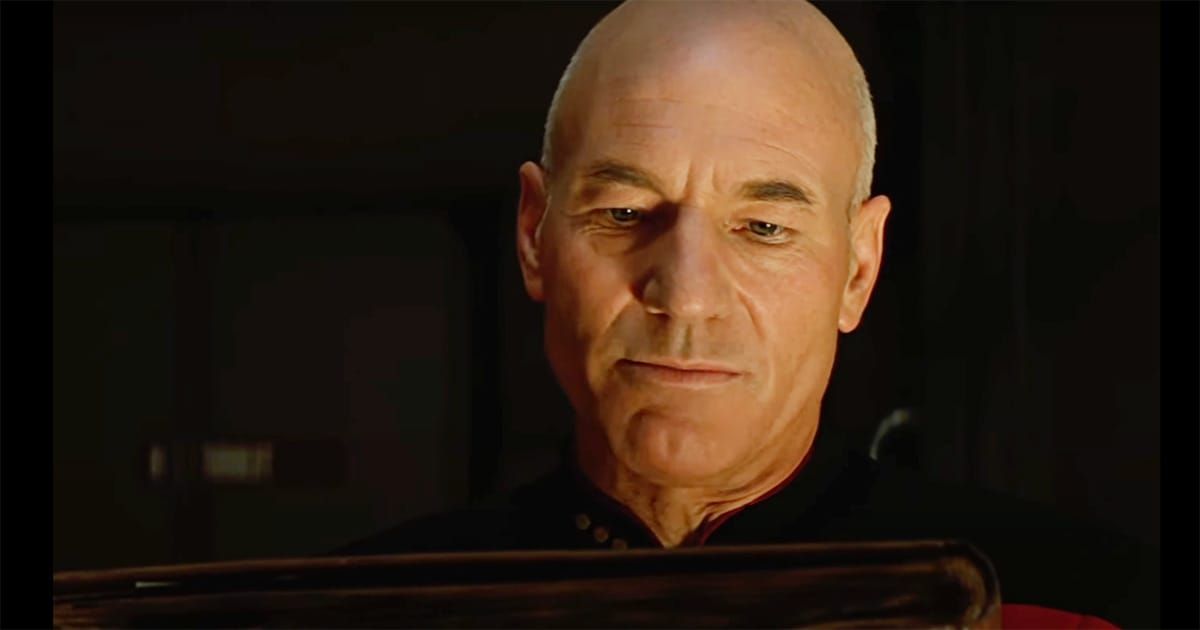 Picard reading a worn book, deep in thought
