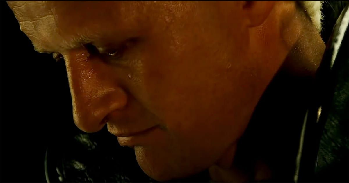 Close-up of Roy Batty looking down in the rain during his final scene in "Blade Runner"