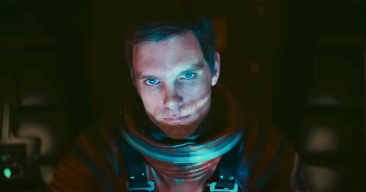 Dave Bowman in a space suit staring ahead aboard "Discovery One" in "2001: A Space Odyssey"