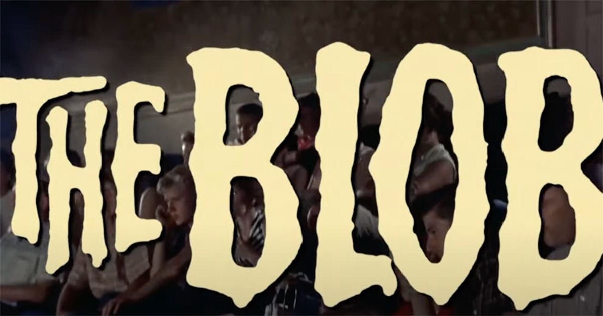 The Blob 1958 movie title card with audience watching in background.