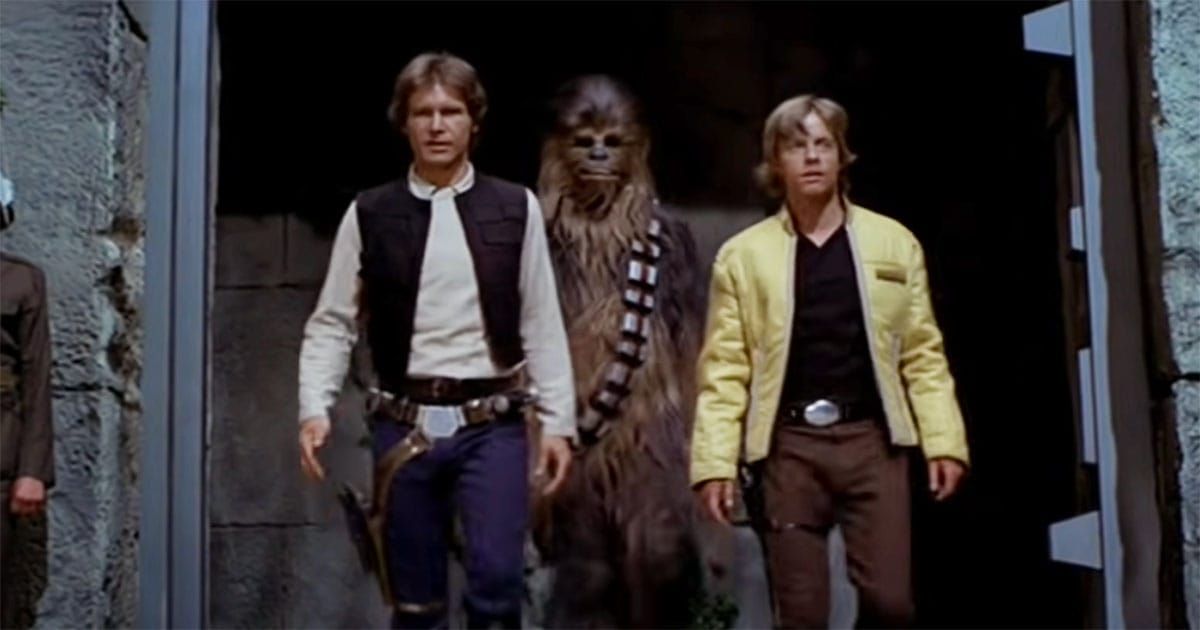 Han Solo, Chewbacca, and Luke Skywalker walk together in a scene from "Star Wars: A New Hope."