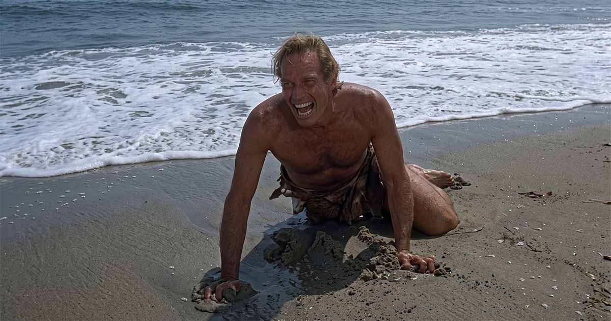 Taylor crawls across a beach in the closing scene of "Planet of the Apes" (1968).
