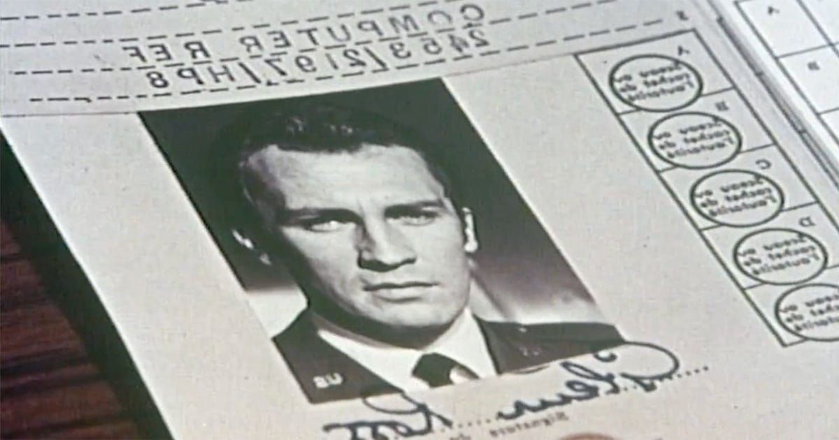 Reversed identification document from "Journey to the Far Side of the Sun" showing Glenn Ross on the mirror Earth.