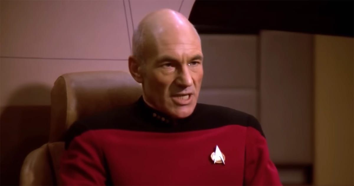 Patrick Stewart as Jean-Luc Picard seated in the captain’s chair aboard the USS Enterprise-D.