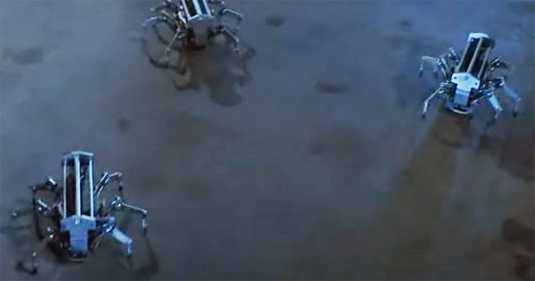 Three robotic spider drones from the film "Runaway" crawling across a dim industrial floor.