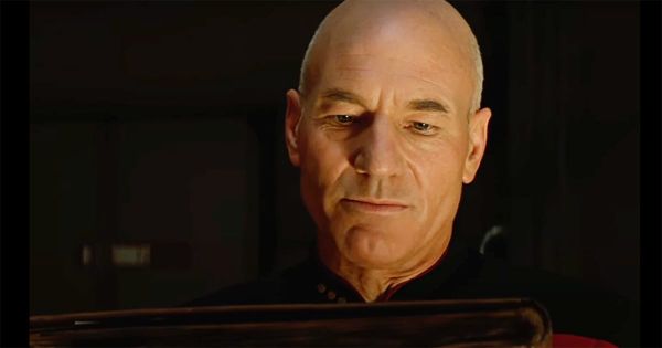 Picard reading a worn book, deep in thought