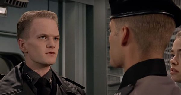 Carl Jenkins and Johnny Rico face each other in "Starship Troopers," highlighting the tension of military loyalty.