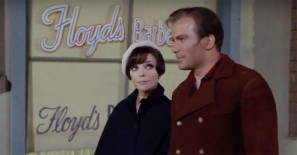 Joan Collins as Edith Keeler walking with William Shatner as Captain Kirk in front of Floyd’s Barbershop in a 1930s setting from "The City on the Edge of Forever" episode of "Star Trek"