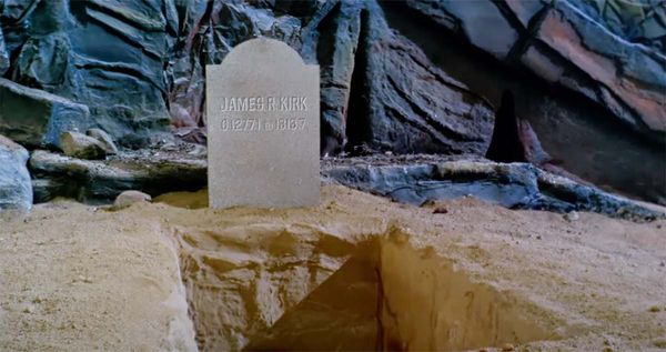 Gravestone reading James R Kirk from Star Trek episode Where No Man Has Gone Before with open grave on Delta Vega