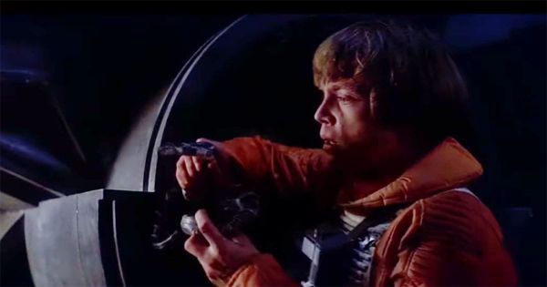 Luke Skywalker actor Mark Hamill with a live snake during The Empire Strikes Back Dagobah filming