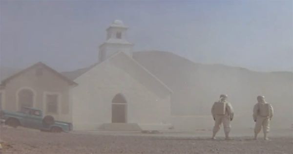 Scientists in protective suits investigate a deserted desert town after a mysterious biological event in the film "The Andromeda Strain" (1971).