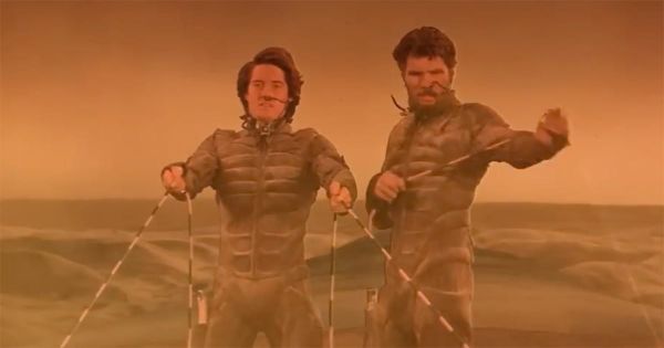 Stilgar and Paul Atreides riding a sandworm across the deserts of Arrakis, practicing the Fremen art of sandworm riding.