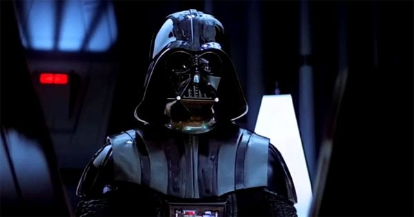 Darth Vader standing in black armor with breathing mask in Star Wars Episode IV A New Hope.