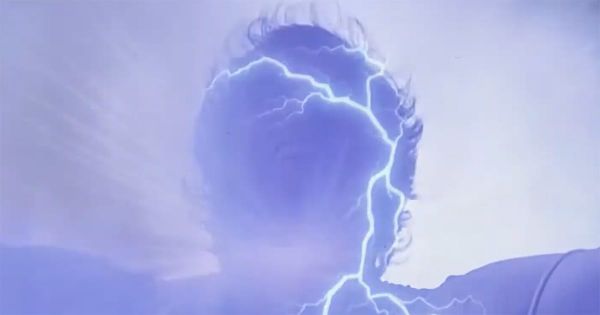 Man surrounded by blue lightning during time travel transition in Quantum Leap