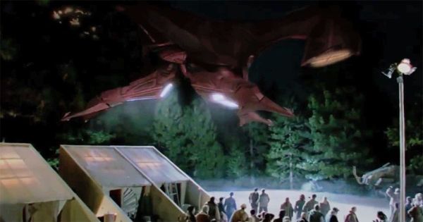 Star Trek First Contact Vulcan ship landing in Montana with people gathered below at night.