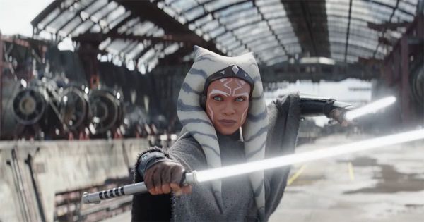 Ahsoka Tano holding dual white lightsabers in an industrial setting, representing the Grey Jedi concept in Star Wars.