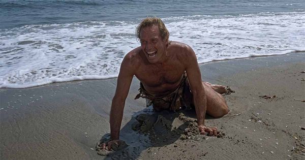 Taylor crawls across a beach in the closing scene of "Planet of the Apes" (1968).