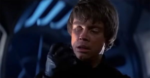 Luke Skywalker looks at his black-gloved mechanical hand after severing Darth Vader's cybernetic hand during the throne room duel in "Return of the Jedi."
