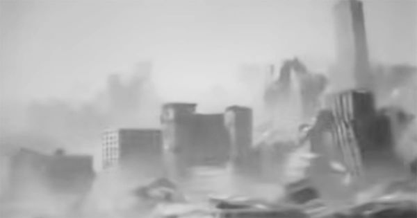 Black-and-white frame from "Deluge" (1933) showing buildings collapsing amid the destruction of New York City.
